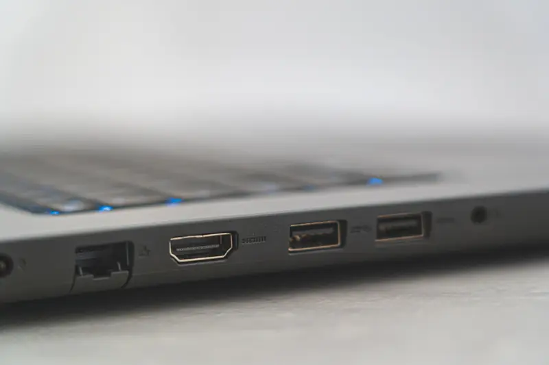 Detailed view of laptop ports including HDMI, USB, and Ethernet, showcasing connectivity options