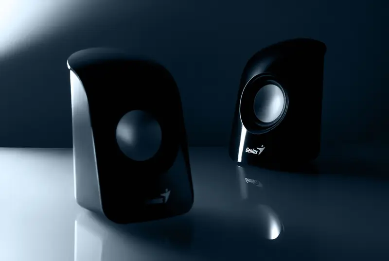 Stylish black desktop speakers with reflective design for enhanced audio experience