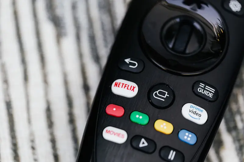 Detailed image of a remote control featuring streaming service buttons